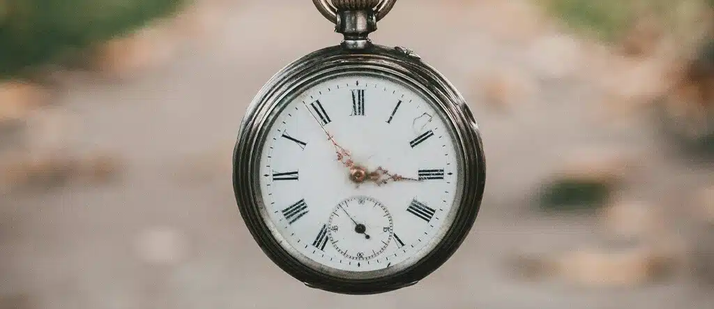 Close-up of a classic fob watch, symbolizing limited time or time constraints