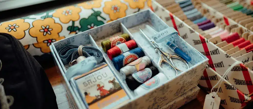 Box of cotton reels and craft supplies representing a hobby turned into an online startup business