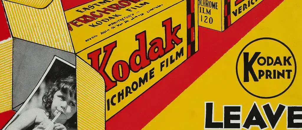 Kodak film canister with a Kodak Print ad sign, representing the concept of display advertising vs. affiliate marketing