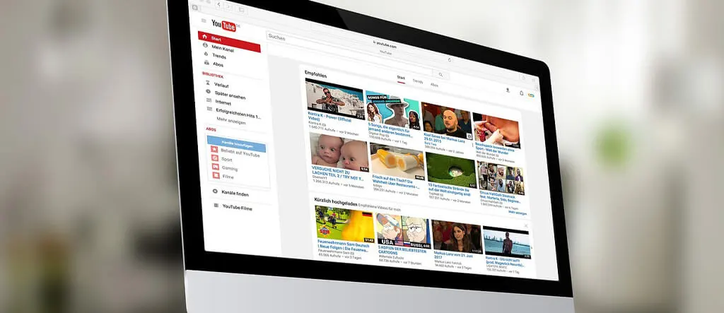 Screenshot of YouTube's homepage featuring a search bar and video thumbnails, showcasing a variety of free tutorials and resources for online selling.